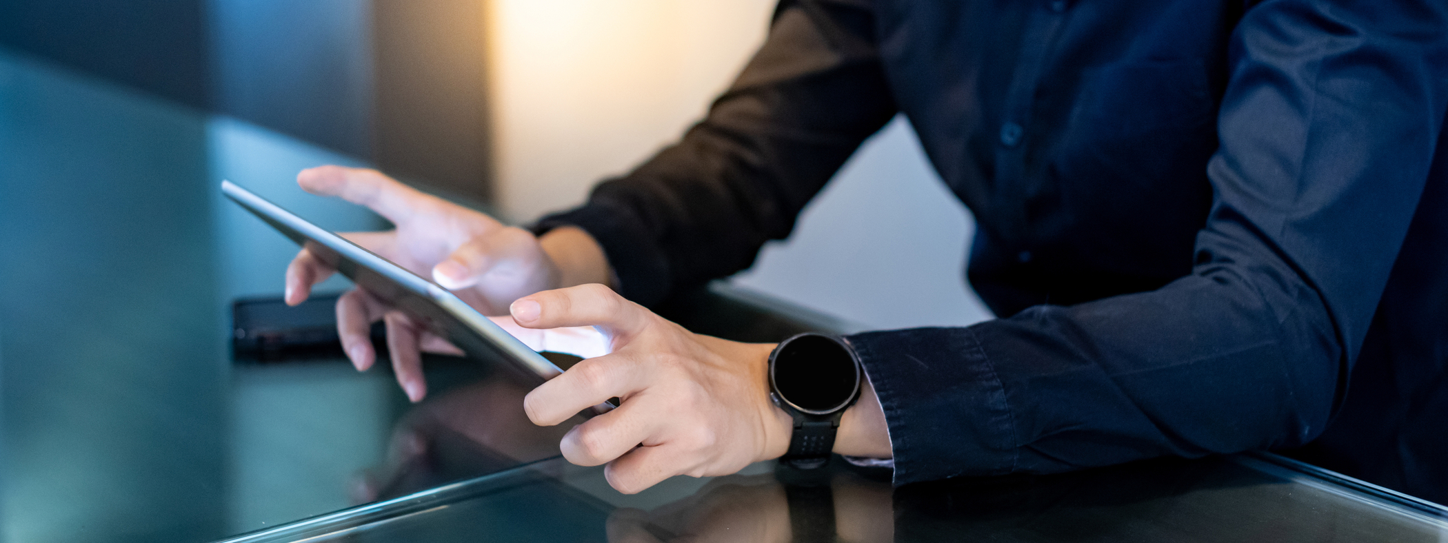 Man's hands holding a digital tablet, connecting via 5G networks